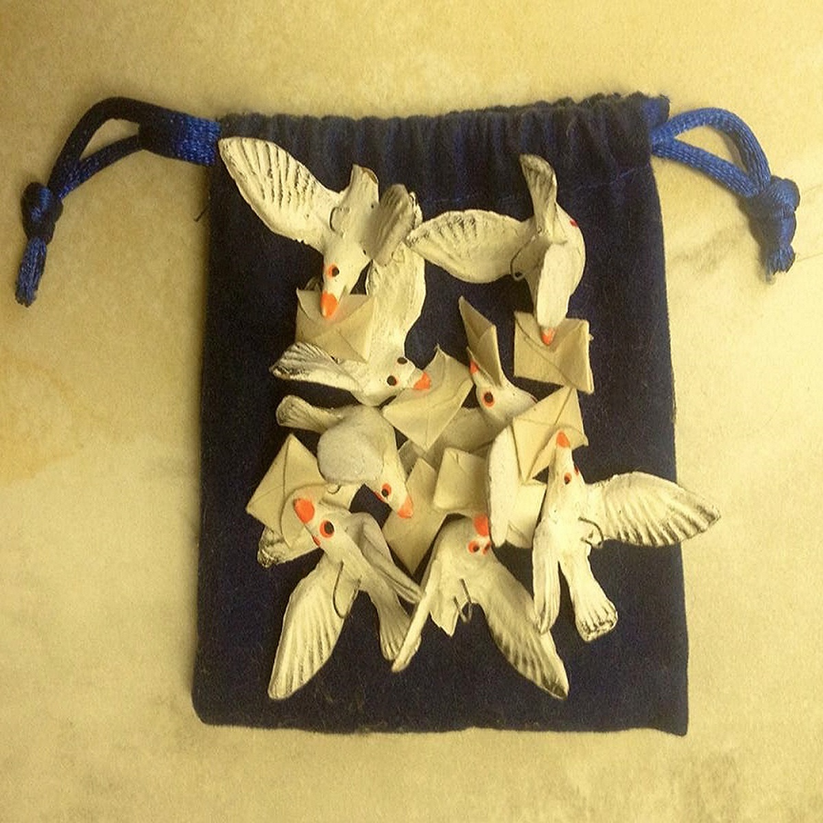 'flight of Mexican carrier pigeon ornaments' by Steve Gentile